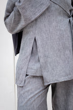 Gray suit jacket and pants on a white background